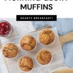 Homemade sourdough morning glory muffins on a wooden board being served with jam with text overlay for a Pinterest pin image.