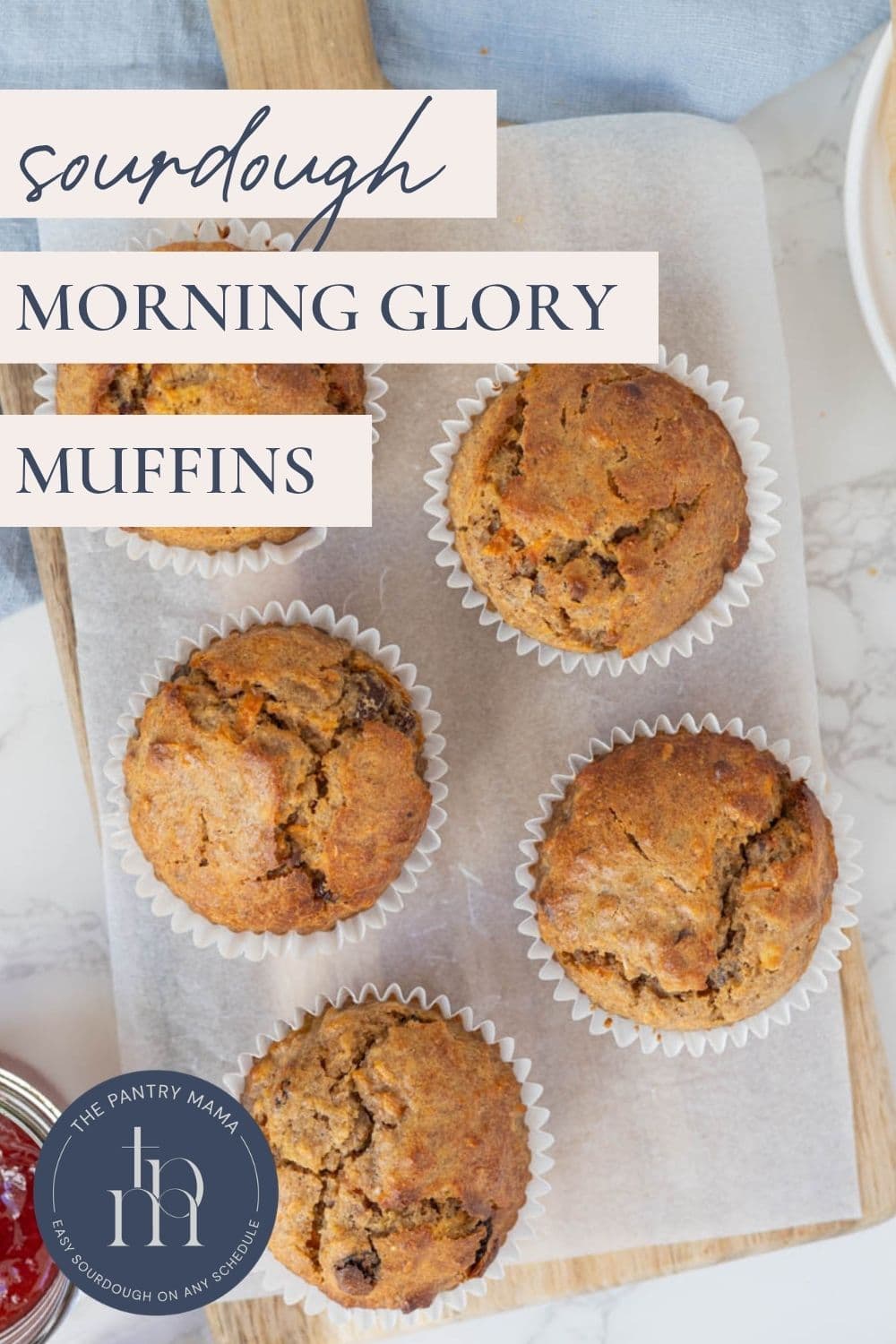 Sourdough morning glory muffins on a wooden board for serving with text overlay for a Pinterest pin image.