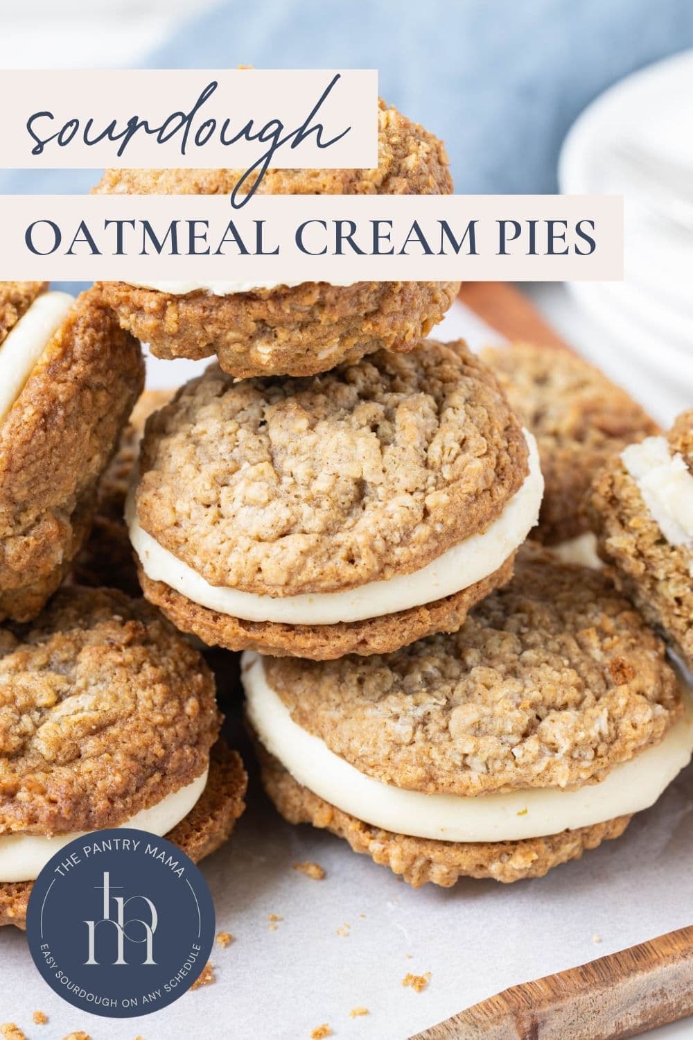 Several sourdough oatmeal cream pies stacked together with text overlay reading "Sourdough Oatmeal Cream Pies."
