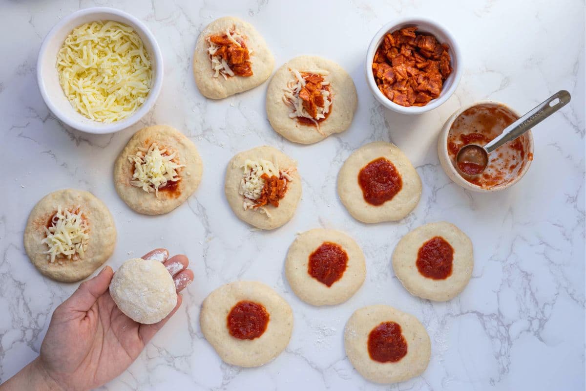 Sealing a sourdough pizza pocket with fillings inside to bake.