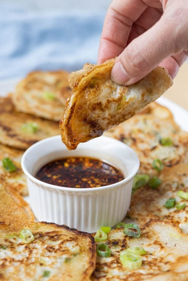 Crispy sourdough scallion pancake dipped into a spicy soy chili dipping sauce.