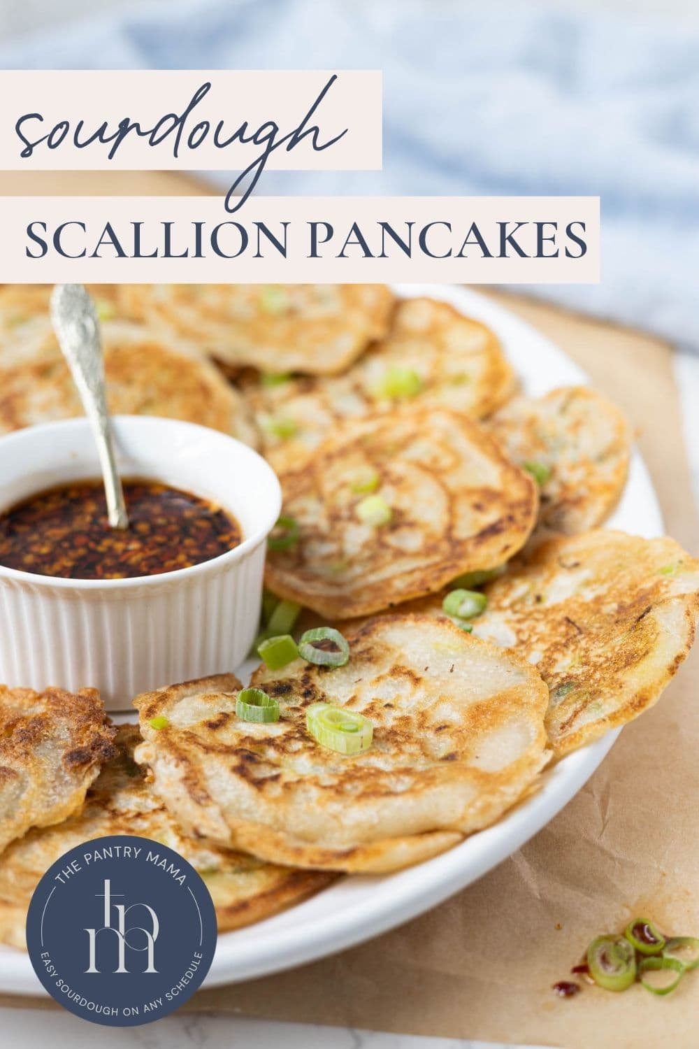Golden brown sourdough scallion pancakes served with a savory chili dipping sauce.