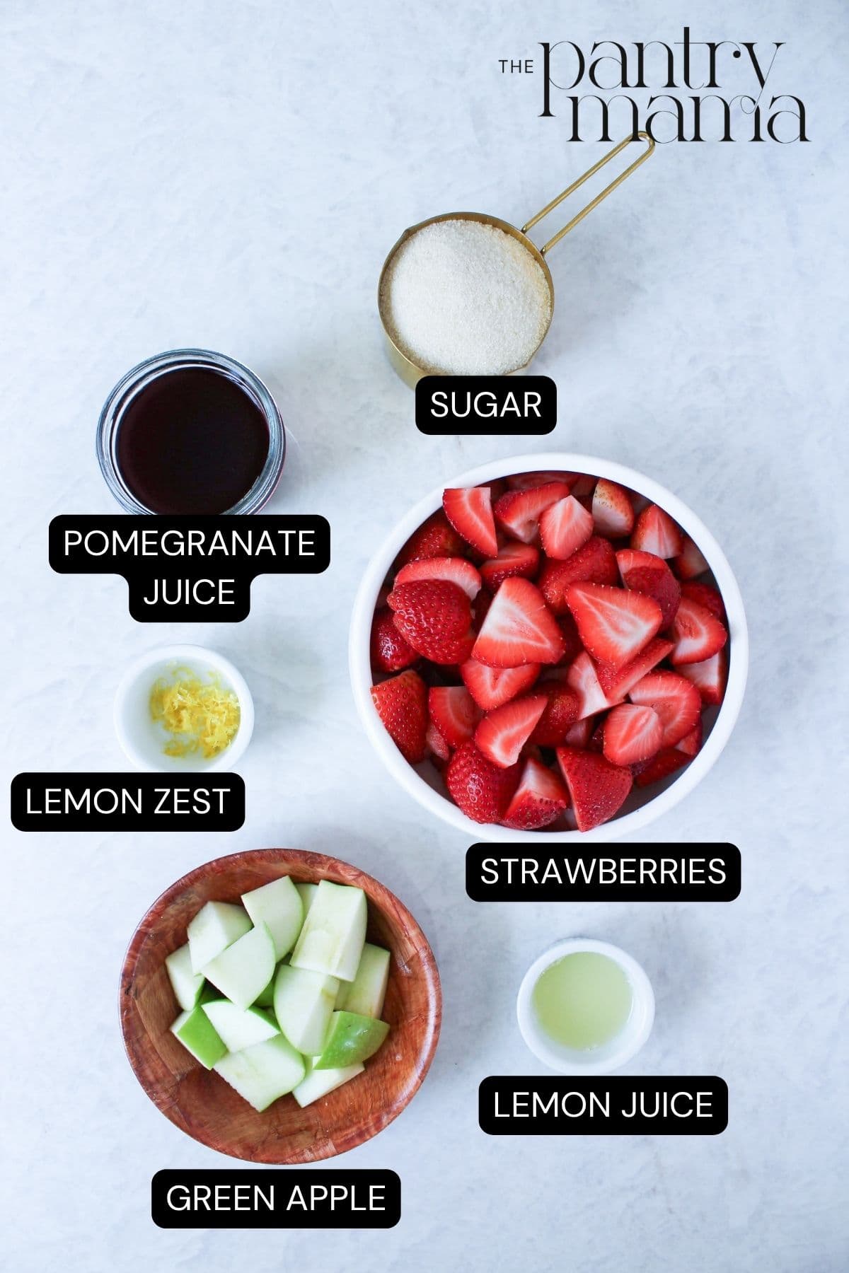 Labeled ingredients to make strawberry pomegranate jam.