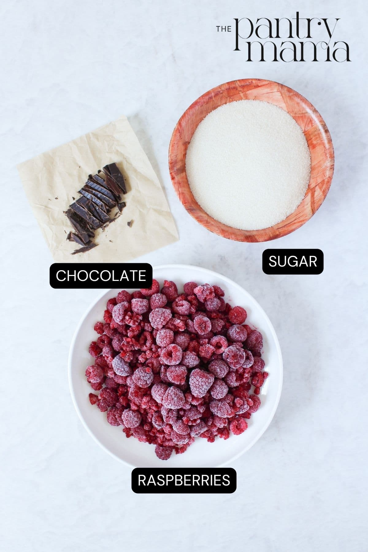Labeled ingredients to make raspberry and chocolate jam.