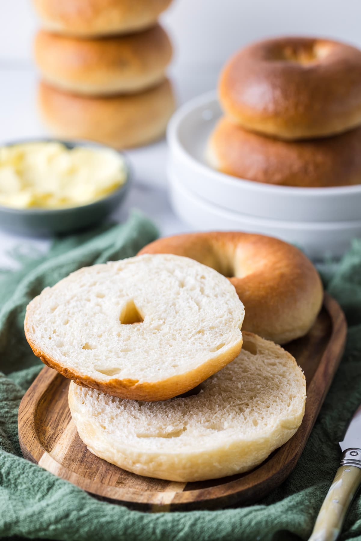 Homemade sourdough bagel sliced open to show its soft, chewy crumb.