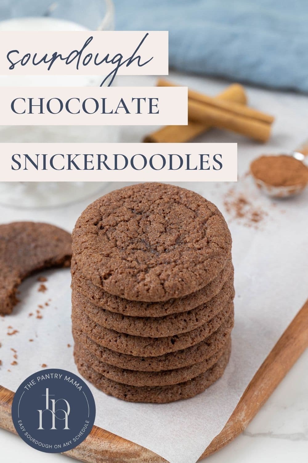 Pinterest graphic for sourdough chocolate snickerdoodle cookies featuring a stack of cookies on parchment paper.
