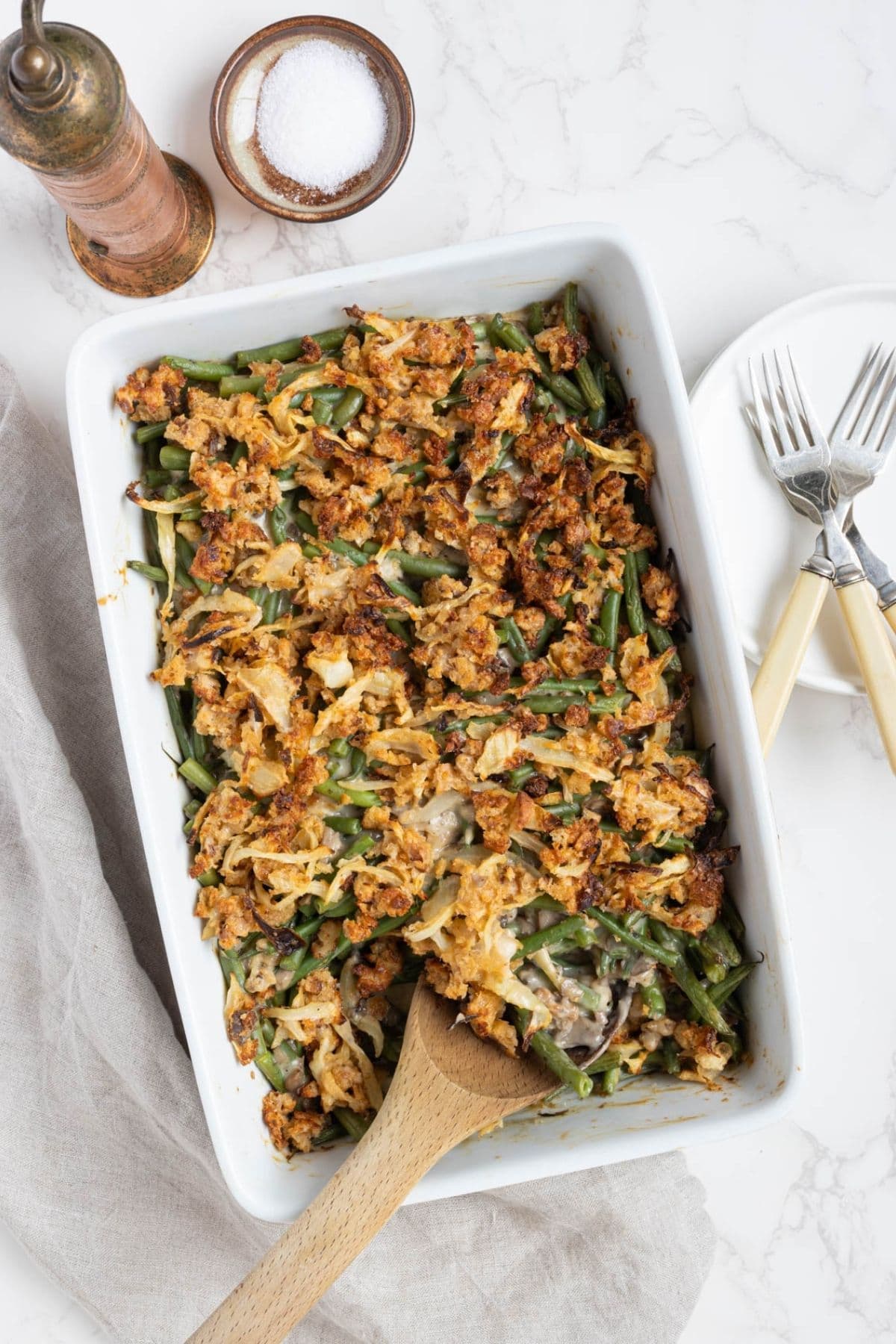 Homemade sourdough green bean casserole baked with creamy mushroom sauce and crispy onion topping.