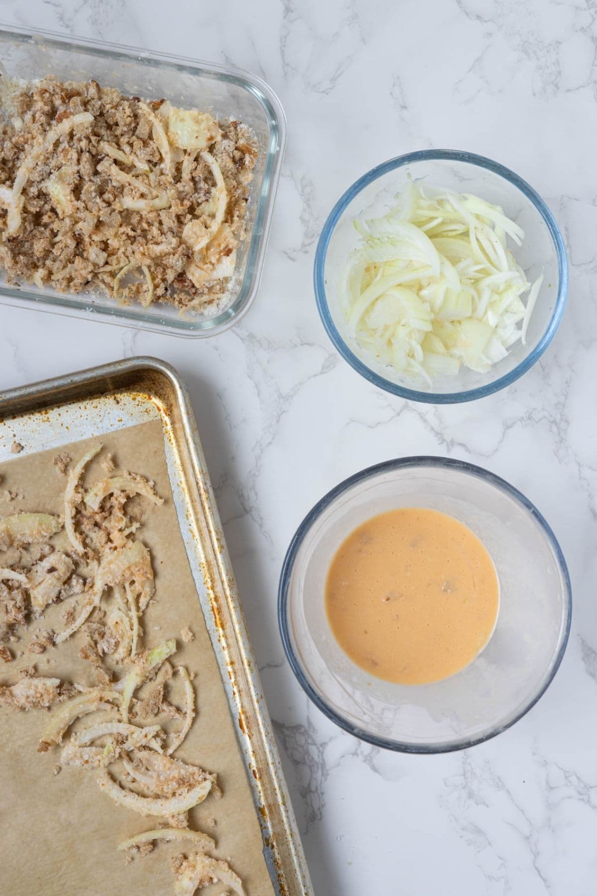 Ingredients for homemade crispy onion topping with sliced onions and sourdough breadcrumbs.