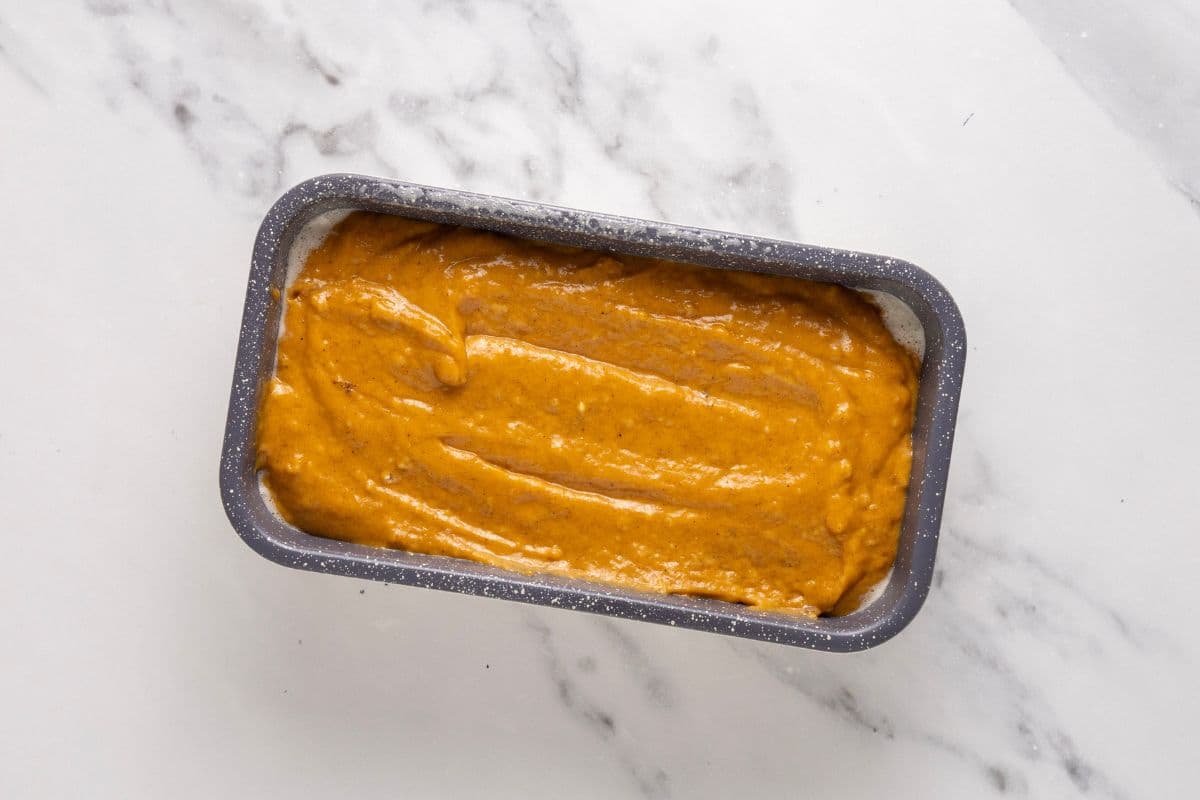 A photo showing the batter poured inside a 1.25 lbs loaf pan.