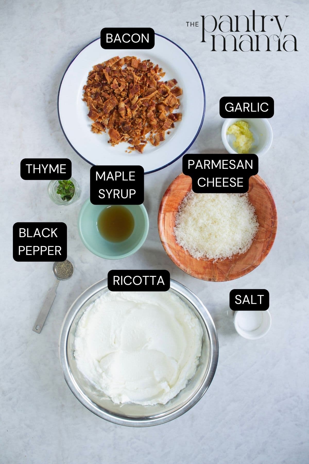 A flat lay image of the ingredients needed to make maple bacon baked ricotta dip.