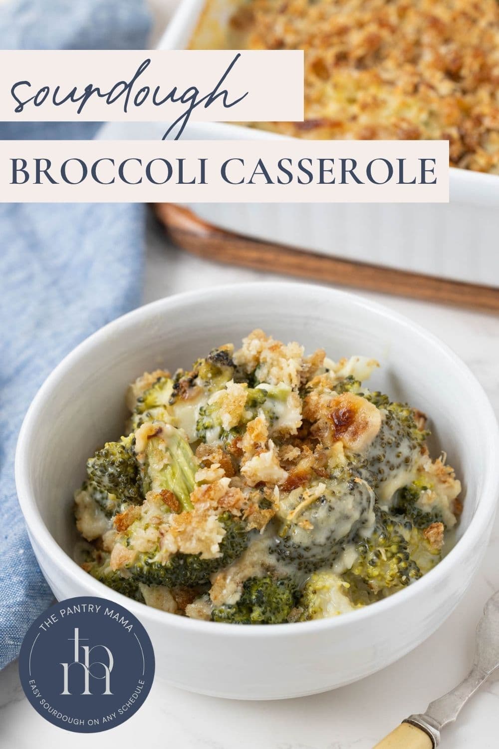 Bowl of creamy sourdough broccoli casserole with broccoli florets and golden breadcrumbs, with text reading “Sourdough Broccoli Casserole.”