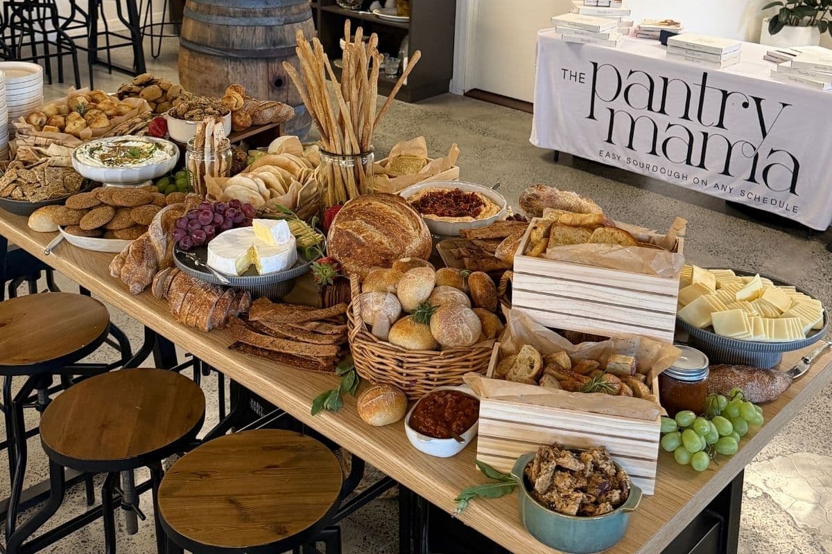 A photo showing the bread grazing table created by Kate Freebairn from The Pantry Mama for the official launch of her book Easy Sourdough On Any Schedule.